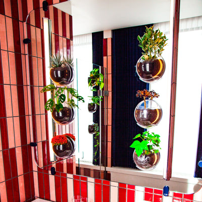 The Standard Hotel in London features Urbz window planters on the mirrors and shower doors of the bathroom.
